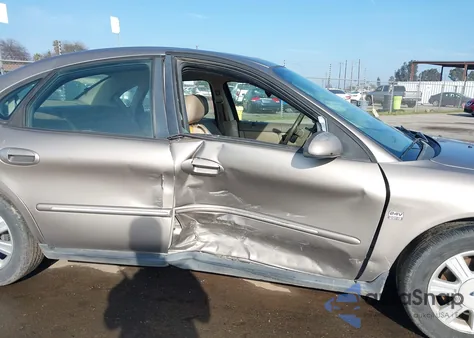 2004 Ford Taurus Sel z USA, uszkodzony, nr VIN 1FAHP56S24G134631